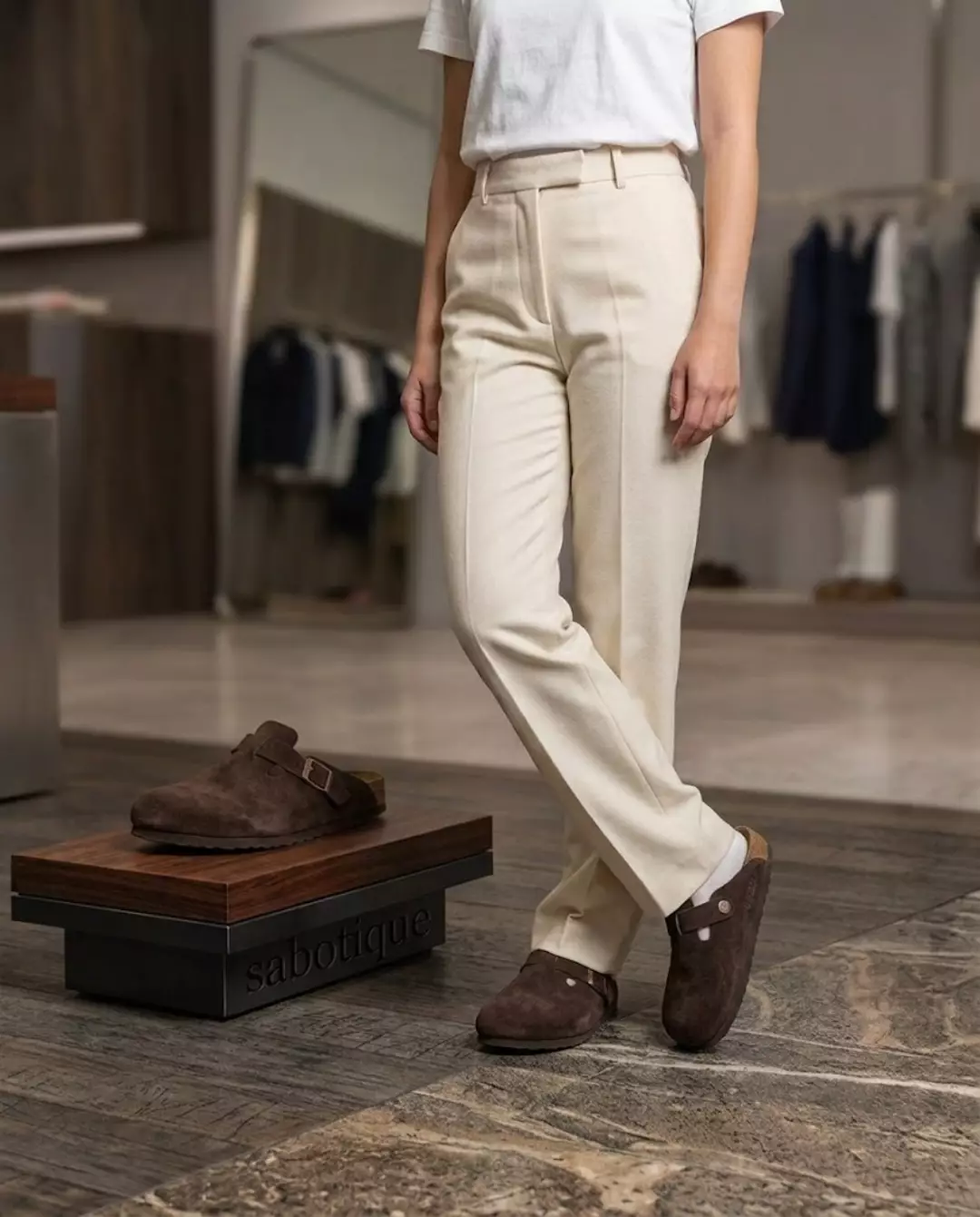 Brown suede clogs with cream trousers