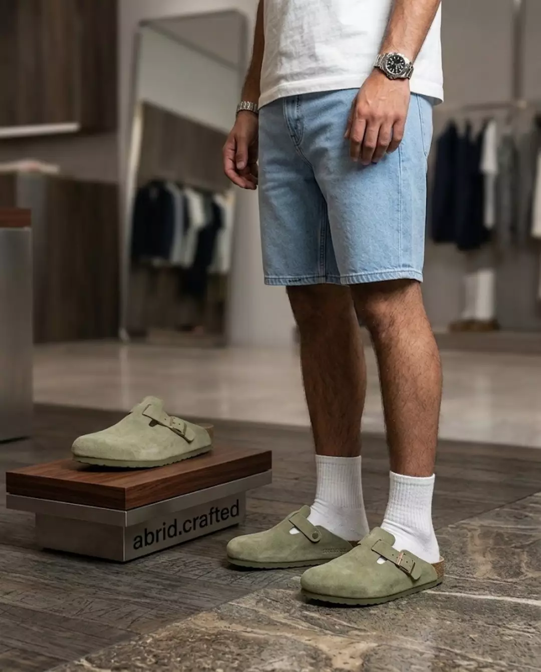 ABRID suede clog in sage, worn with white socks